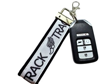 Personalized Track Keychain: Fabric Key Fob with Optional Initial Charms on Black Background