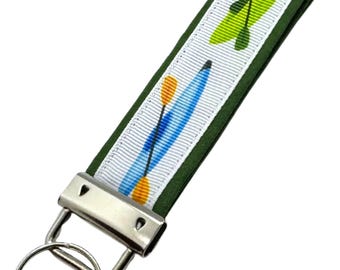Personalized Kayak Keychain: Fabric Key Fob with Optional Initial Charms on Green Background