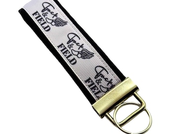 Personalized Track & Field Keychain: Fabric Key Fob with Optional Initial Charms on Black Background