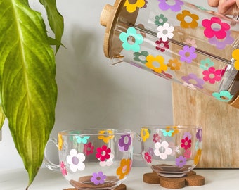 Set caffettiera e tazza con fiori arcobaleno