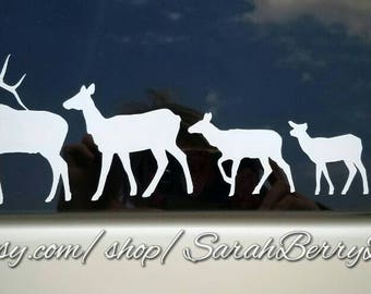 May include: White silhouette vinyl decal of an elk and four deer, arranged in a line, on a blue car window. The decal is a popular choice for car enthusiasts and nature lovers.