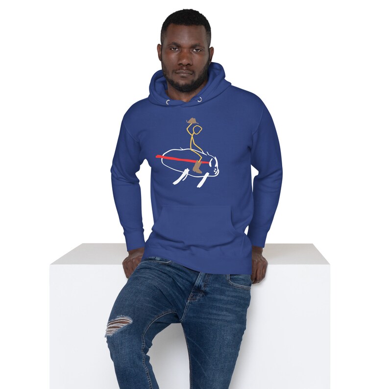 May include: A royal blue hoodie with a stick figure riding a bull graphic. The stick figure is wearing a cowboy hat and boots.