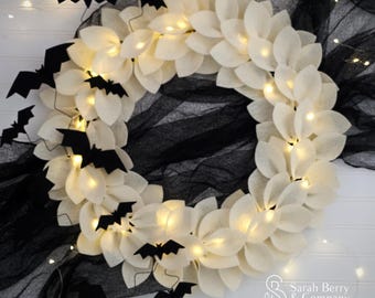 Lighted Halloween Bat Felt Wreath: Ivory & Black Spooky Decor
