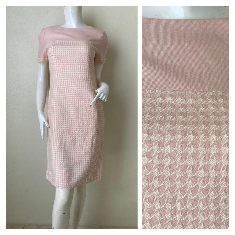 May include: A pink and white gingham dress with short sleeves. The dress has a solid pink top and a gingham bottom.