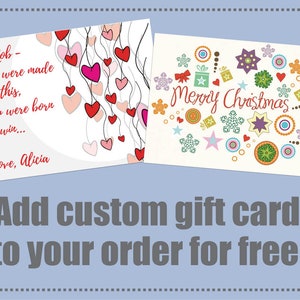May include: Two gift cards are displayed. One card has red and pink hearts with the text "To Rob - You were made for this, you were born to win... Love, Alicia." The other card says "Merry Christmas" with colorful festive designs.