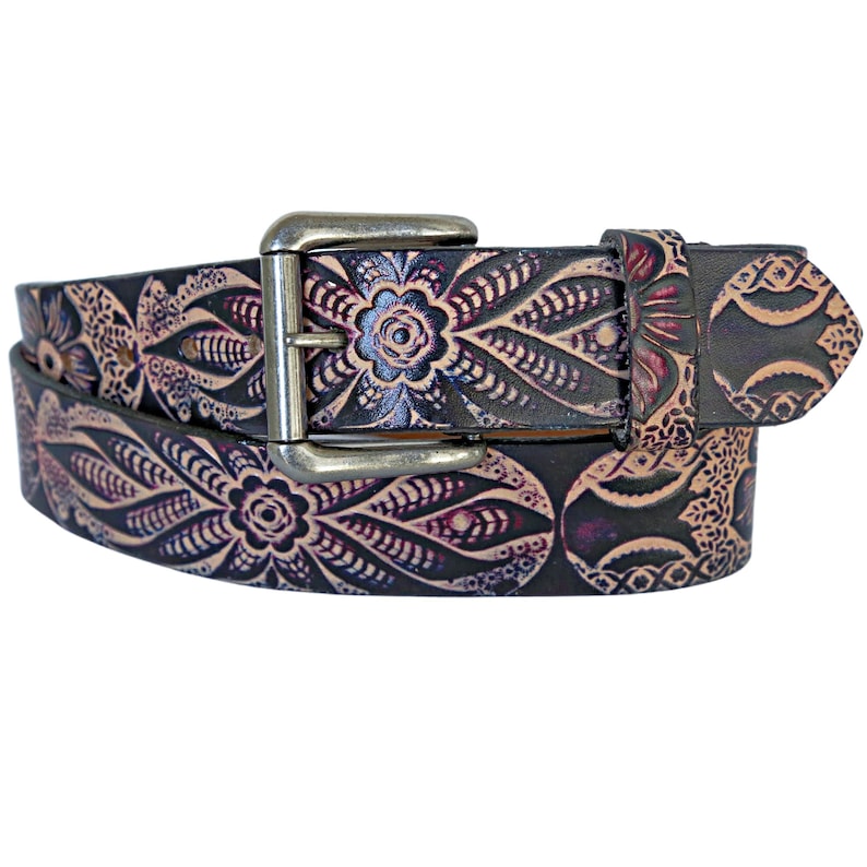 May include: A brown leather belt with a silver buckle. The belt is decorated with a floral pattern in shades of purple and pink.