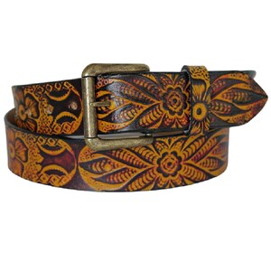 May include: A brown leather belt with a gold buckle and a floral pattern. The belt is decorated with intricate details and has a vintage look.