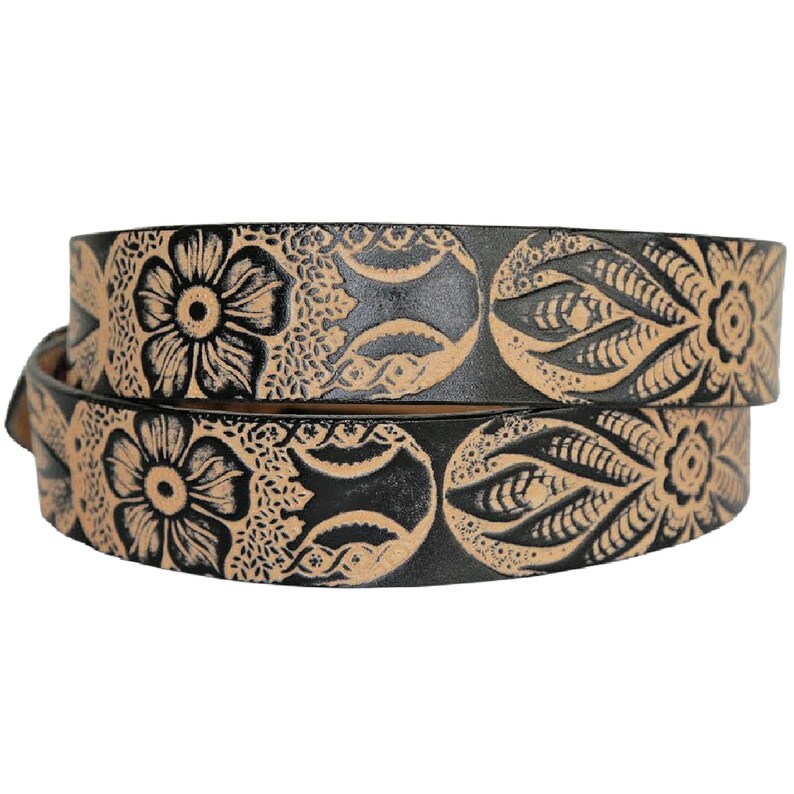 May include: A black leather belt with a tan floral design. The belt is folded in half and the design is visible on both sides.