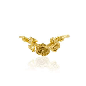 May include: A gold ring with a floral design featuring two delicate flowers and leaves.