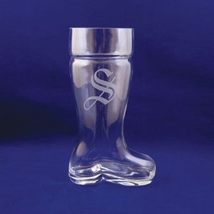 May include: A clear glass boot-shaped beer stein with an etched letter "S" on the front.