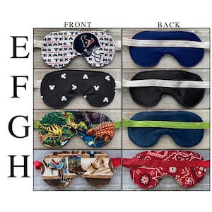 May include: Four sleep masks labeled E through H, showing front and back views. E features a Houston Texans logo and text. F has a black fabric with white mouse icons. G displays a colorful dinosaur print. H shows a western theme with boots and hats.