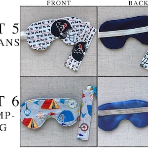 May include: Two sets of sleep masks and matching bookmarks. Set 5 features a white fabric with Houston Texans logos and text. Set 6 features a gray fabric with colorful camping gear illustrations, including tents and compasses, with a solid orange bookmark.