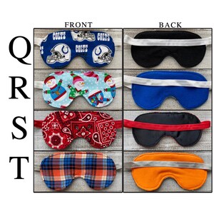 May include: Four sleep masks labeled Q, R, S, and T. Q features a blue Colts football print. R shows a snowman pattern on light blue. S displays a red and white paisley print. T has an orange and blue plaid pattern. Each mask includes an elastic strap.
