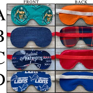 May include: Four sleep masks labeled A through D, each showing front and back views. A features Aquaman graphics, B has a blue denim-like front and plaid back, C displays New England Patriots branding with a red back, and D shows Detroit Lions logos.