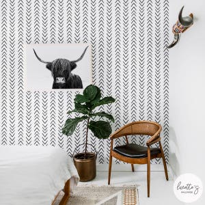 Arrow print removable wallpaper in a Scandinavian interior design bedroom