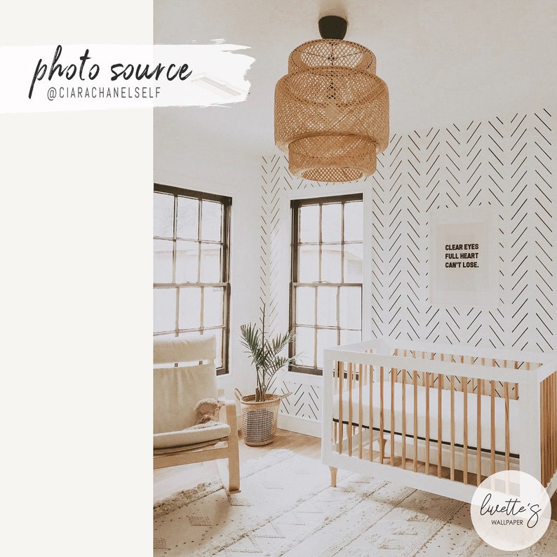 bohemian kids nursery with simple herringbone print wallpaper