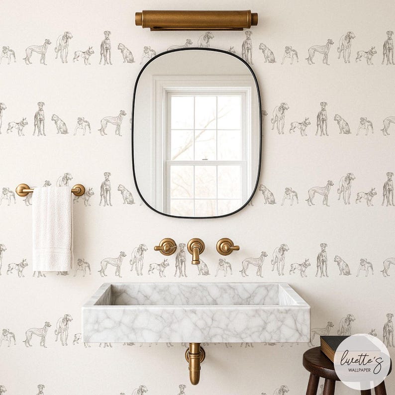May include: A bathroom with a marble sink, gold fixtures, and a black-framed mirror. The wallpaper features a repeating pattern of dog illustrations in gray. A white towel hangs on a gold towel rack. A dark wooden stool is next to the sink.