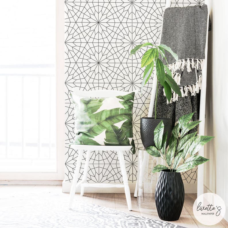 bright and airy interior with wallpaper and greenery