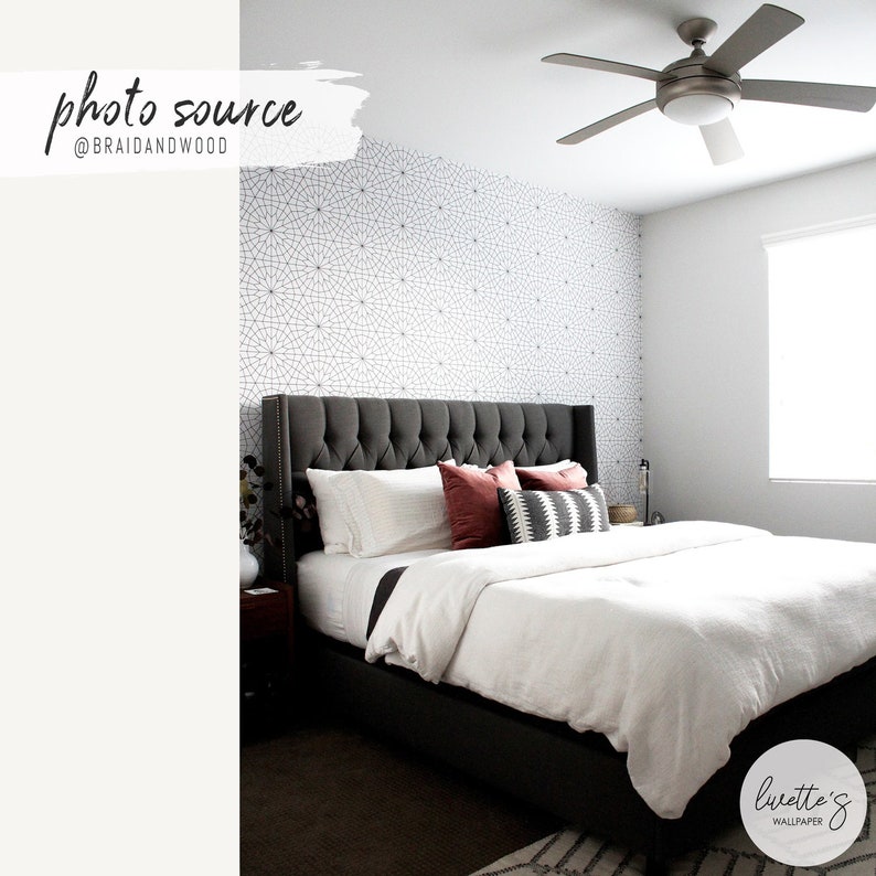 modern bedroom interior with geometric wallpaper design