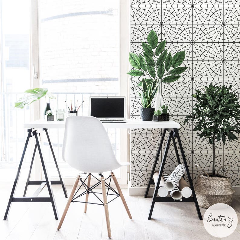 bright and airy office interior with wallpaper and greenery