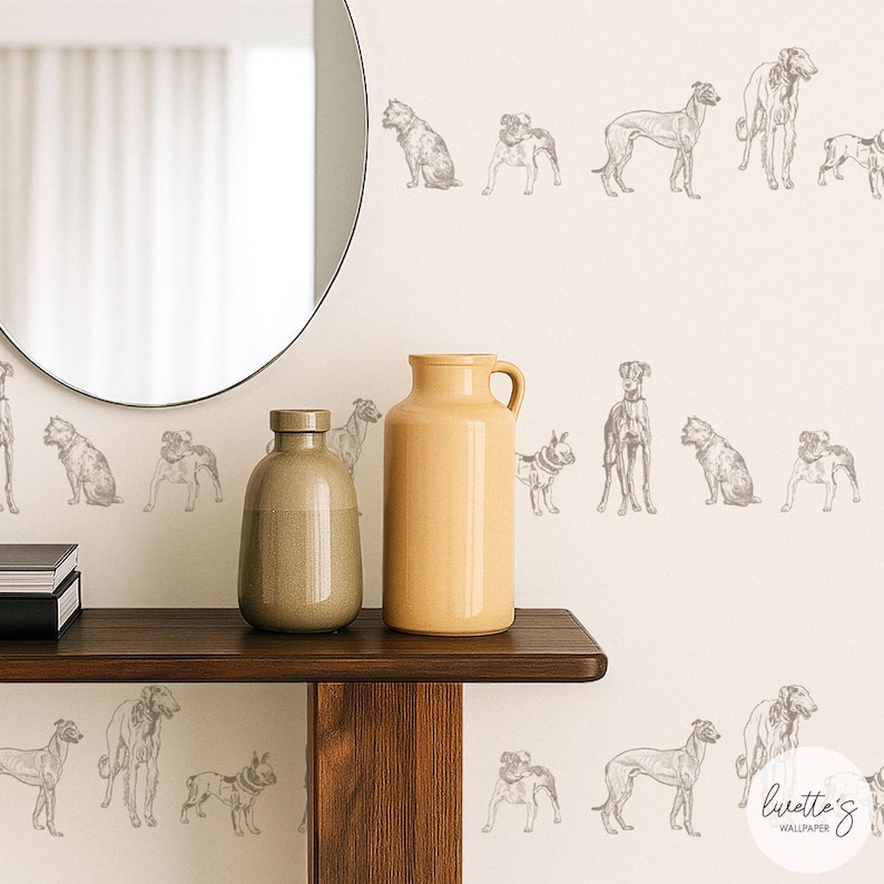 May include: Beige wallpaper featuring a repeating pattern of various dog breeds in a sketched style. The dogs are depicted in shades of gray. A wooden shelf holds two ceramic vases. A round mirror is visible in the background.