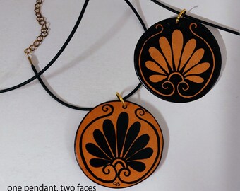 ancient Greece style double-faced pendant hand painted on terracotta. Decorative palmette front and back, positive and negative