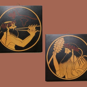 May include: Two square wall art pieces with black backgrounds and circular illustrations. One shows a figure playing a flute, the other depicts two figures holding wheat. The figures are in tan with red and gold accents.