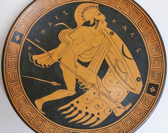 A hand-painted Greek warrior on a ceramic plate, a copy of a British Museum cup, fired in a ceramic kiln. For lovers of ancient art.