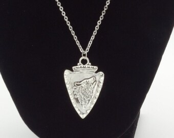Arrowhead wolf pendant
