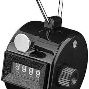 May include: Black hand-held clicker counter with a silver reset button and a digital display showing the number 9999. The counter has a black handle with a silver loop.