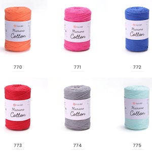 May include: Six spools of YarnArt Macrame Cotton yarn in various colors: orange, pink, blue, red, gray, and mint green. Each spool has a label with the brand name and product details. The numbers 770, 771, 772, 773, 774, and 775 are printed below each spool.