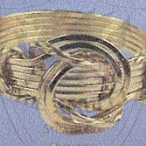 May include: A gold-toned ring with a woven design featuring multiple intertwined circles.