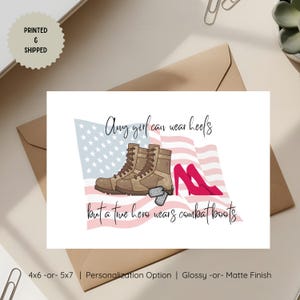 May include: A greeting card featuring a graphic of a waving American flag, a pair of tan combat boots with dog tags, and a pair of bright pink high heels. The text reads, Any girl can wear heels but a true hero wears combat boots.