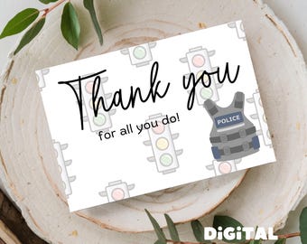 May include: A printable thank you card featuring a police officer's bulletproof vest and traffic lights. The card reads "Thank you for all you do!"