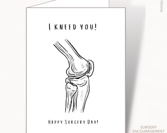 May include: A white greeting card with the text "I KNEED YOU!" above a black and white illustration of a knee joint. The phrase "HAPPY SURGERY DAY!" is printed below the illustration. The card is labeled "PHYSICAL CARD" and "SURGERY ENCOURAGEMENT".