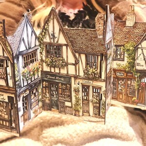Mini tudor village scene with cut out windows for led lights, small house ornament