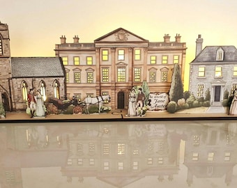 Il mondo di Jane Austen: una scena di villaggio in miniatura splendidamente realizzata per mensole, angoli libreria e davanzali. Aggiungi luci LED per dare vita.