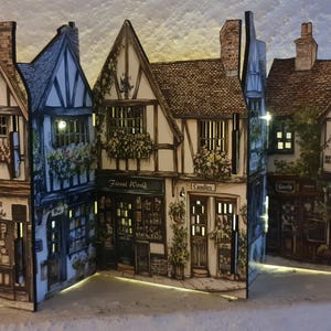 Mini tudor village scene with cut out windows for led lights, small house ornament