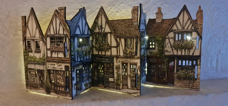 Mini tudor village scene with cut out windows for led lights, small house ornament