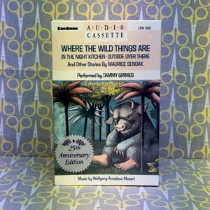May include: A vintage Caedmon audio cassette of "Where the Wild Things Are" by Maurice Sendak. The cover features an illustration of a creature from the story. The cassette is a 25th Anniversary Edition.