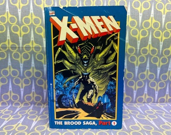 X-Men The Brood Saga, Part 1 by Chris Claremont and John Romita Jr. paperback book vintage