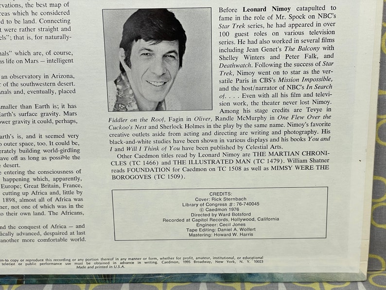 May include: A black and white photo of Leonard Nimoy, known for his role as Mr. Spock in the Star Trek series. The photo is from a record album cover and includes text about his career and other works, including "The Martian Chronicles" and "The Illustrated Man".