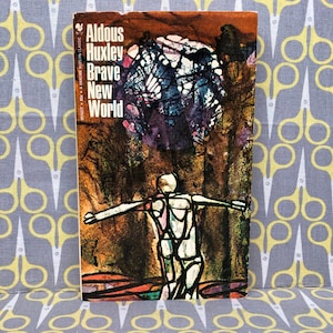 Un mundo feliz por Aldous Huxley libro de bolsillo distopía pesadilla gobierno regla clonación