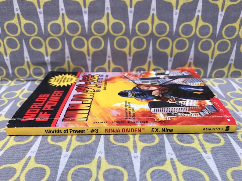 May include: Worlds of Power #3 comic book featuring Ninja Gaiden. The cover features a yellow and red background with a ninja character in the foreground. The text on the cover reads "Ninja Gaiden" and "Worlds of Power #3".