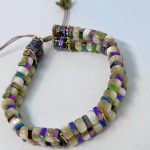 129 2 strand, cream cats eye with square multi colored spacers