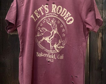 Let's Rodeo Bakersfield Cali 1980's Distressed Unisex T shirt mauve