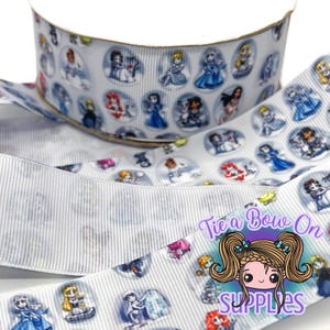 May include: White ribbon with a vertical striped pattern and illustrations of princesses in oval frames. The ribbon is rolled and unrolled, with the text "Tie a Bow On Supplies" in the lower right corner.