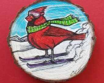 Original art Magnet. Skiing Cardinal.  Green Scarf. 3 inches in diameter. Pastel and ink on wood. Handmade. Cardinal art. Cardinal magnet.