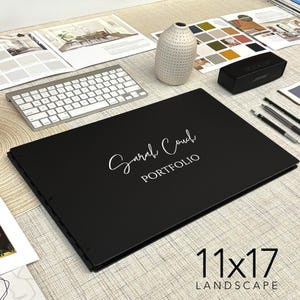 May include: Black portfolio with a white inscription that reads "Sarah Couch PORTFOLIO" and the text "11x17 LANDSCAPE" in white on a gray background.