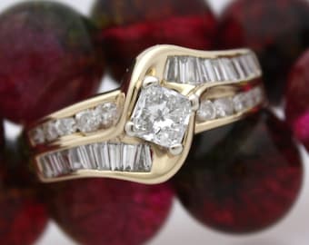 May include: A gold engagement ring with a square-cut diamond surrounded by smaller diamonds. The ring is set on a bed of red beads.